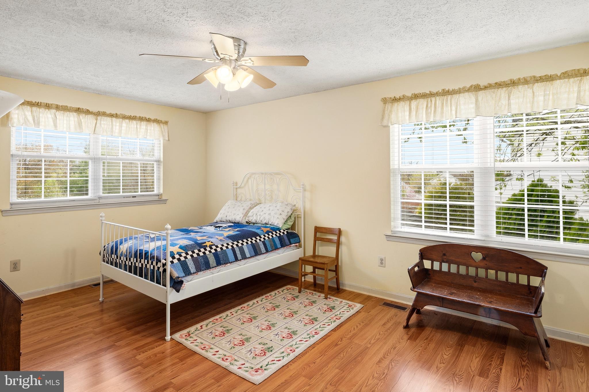 6415 Michael Elizabeth Way Hanover, MD 21076 - Photo 24 of 32 a bedroom with a bed and wooden floor