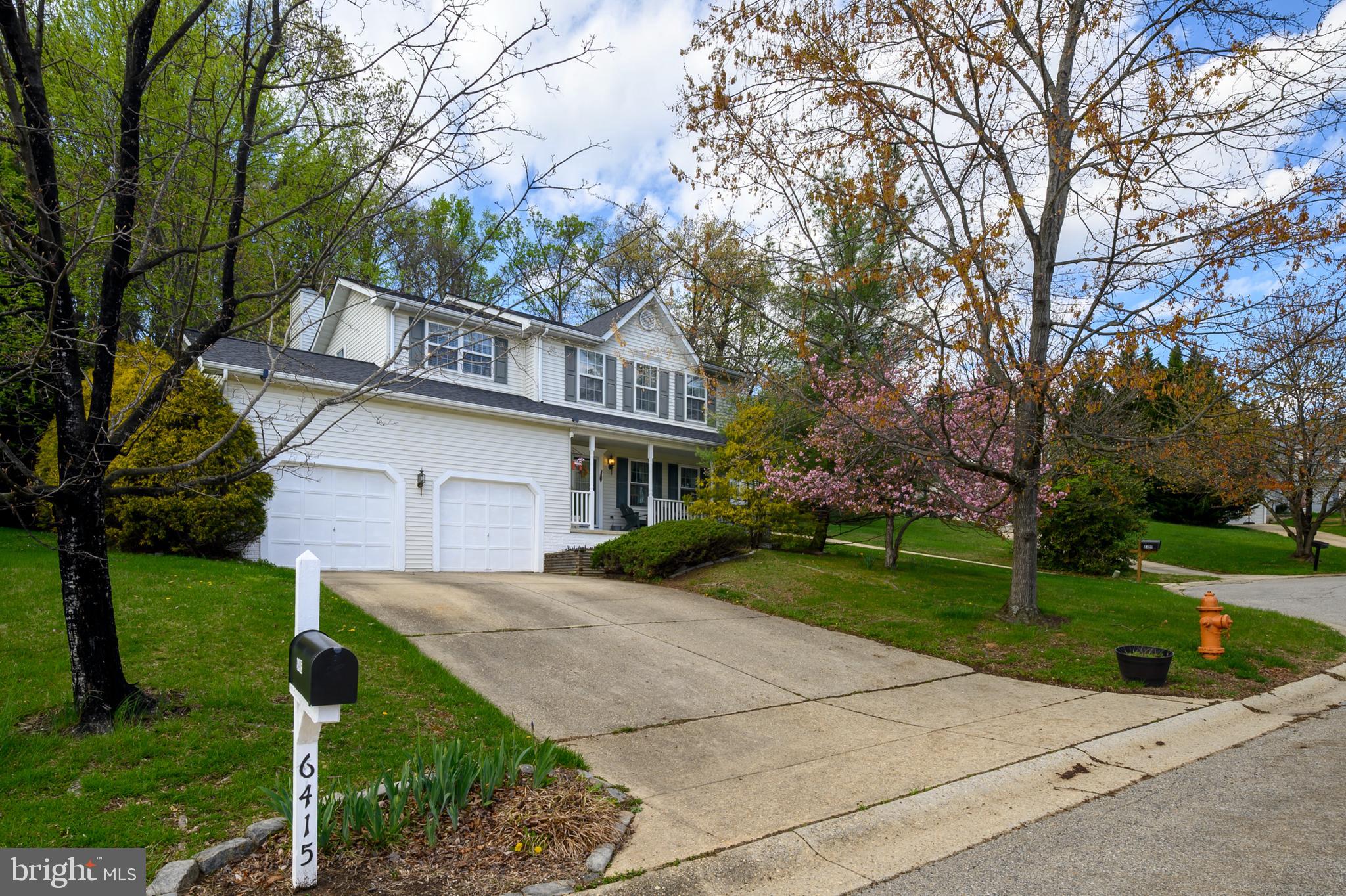 6415 Michael Elizabeth Way Hanover, MD 21076 - Photo 3 of 32 a front view of a house with garden
