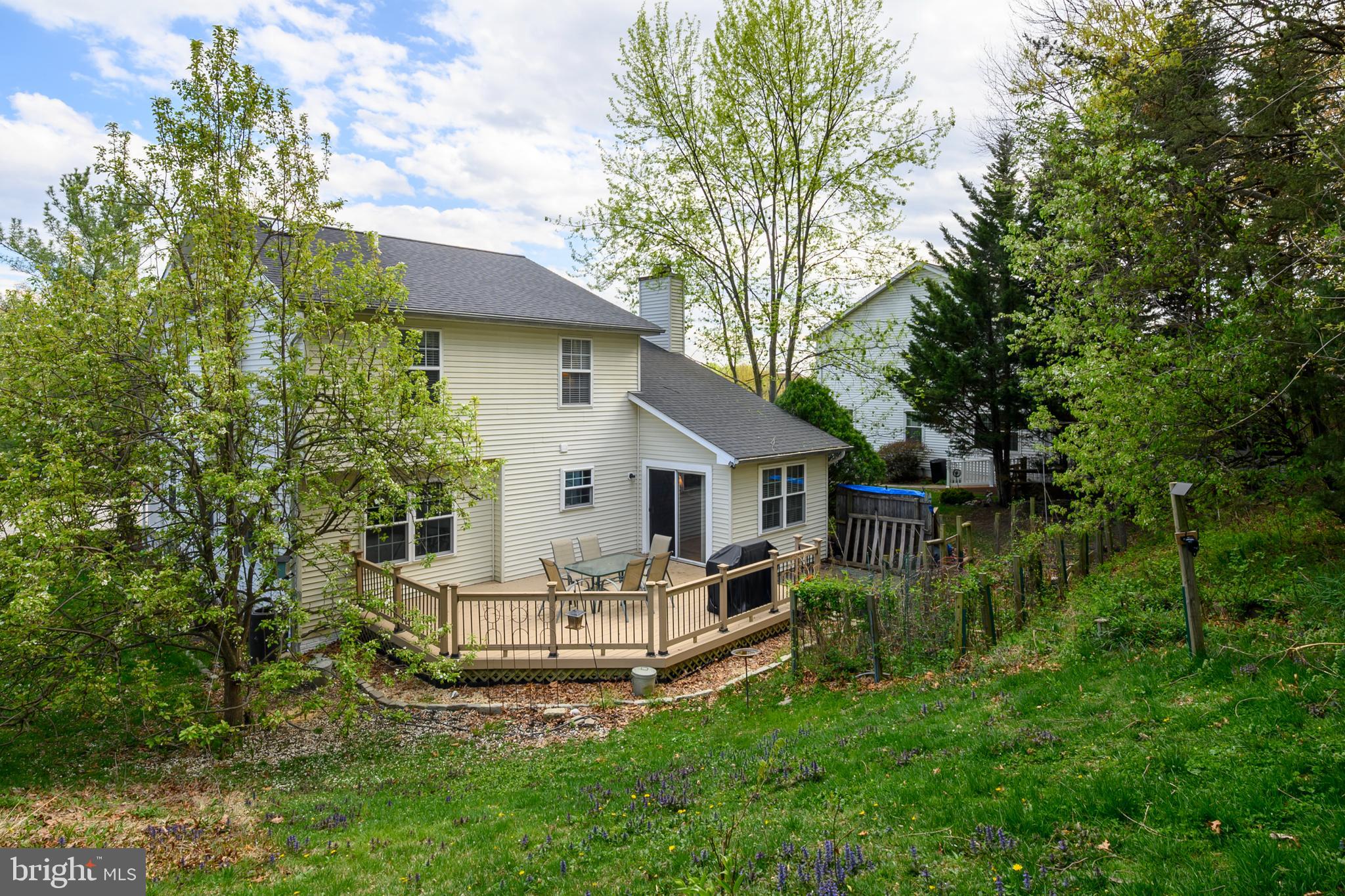 6415 Michael Elizabeth Way Hanover, MD 21076 - Photo 31 of 32 a view of a house with a yard and sitting area