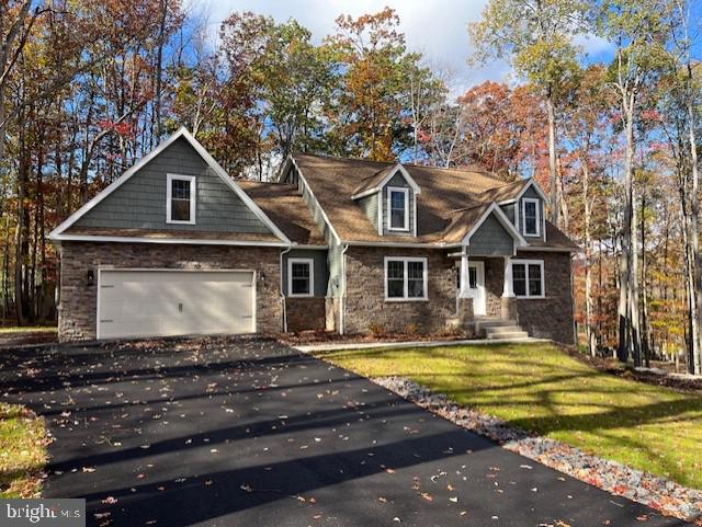 a front view of a house with yard