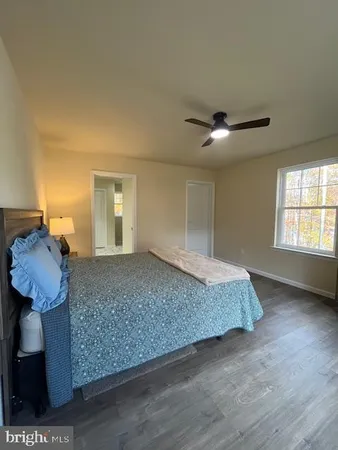 an empty room with a empty space and windows