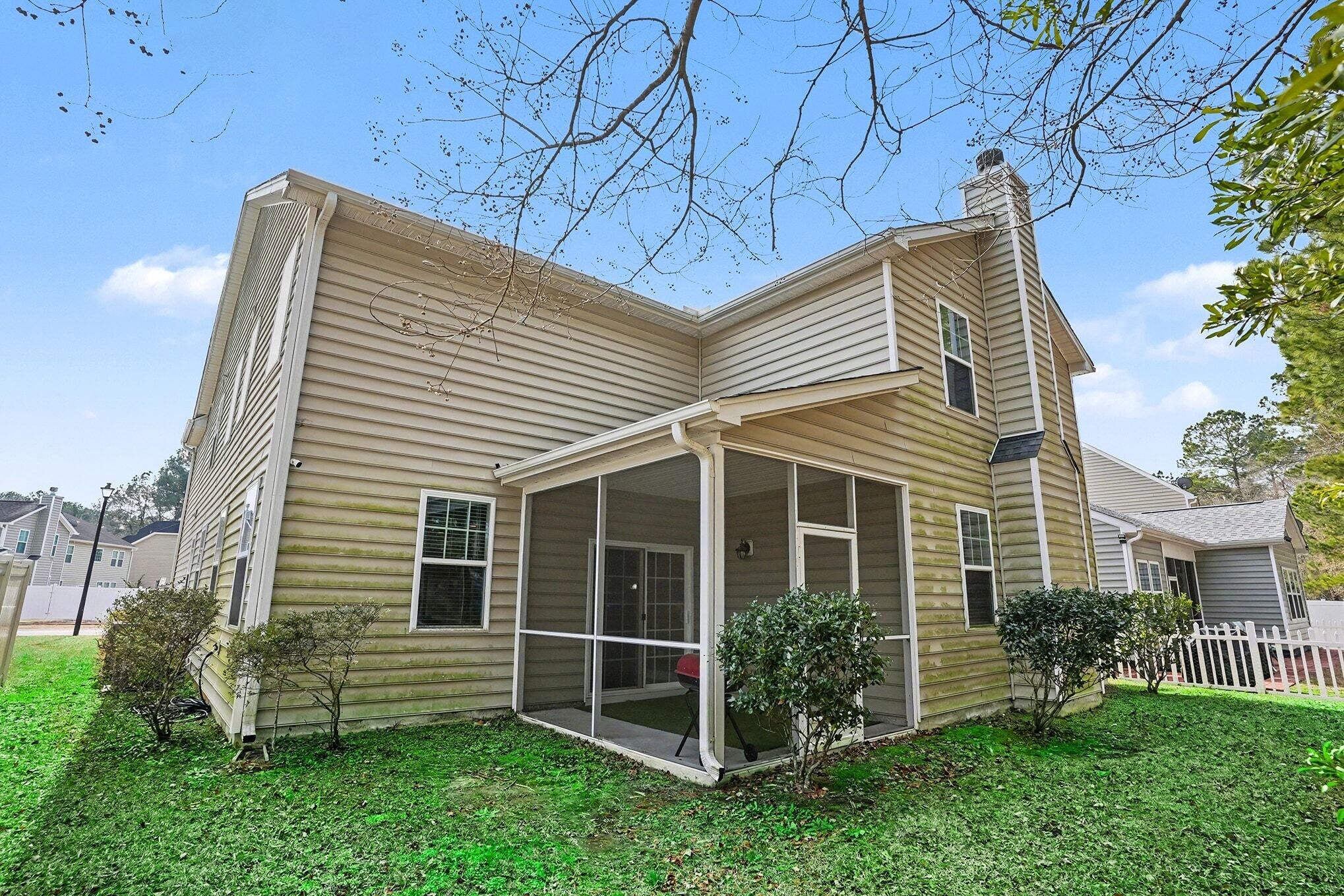 208 Buttonbush Court Moncks Corner, SC 29461 - Photo 33 of 38 Rear Exterior with Screened Porch