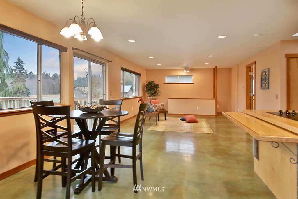 6301 Wahl Road Freeland, WA 98249 - Photo 14 of 40 a view of a dining room with furniture window and outside view