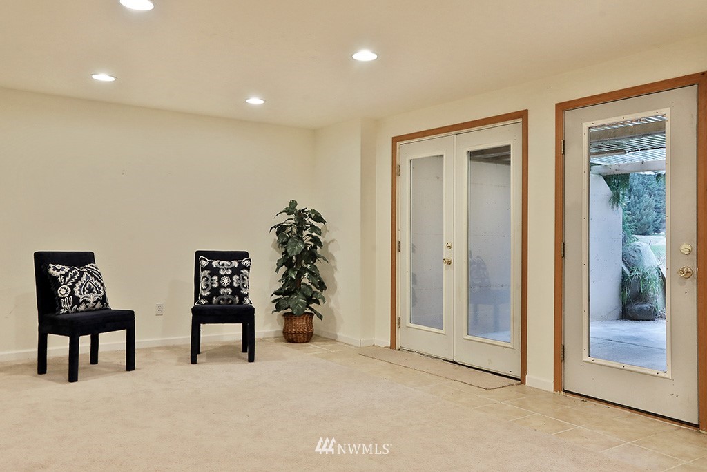 6301 Wahl Road Freeland, WA 98249 - Photo 27 of 40 a view of wooden floor and windows in a room