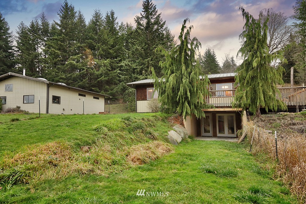 6301 Wahl Road Freeland, WA 98249 - Photo 28 of 40 a view of a house with backyard and a tree