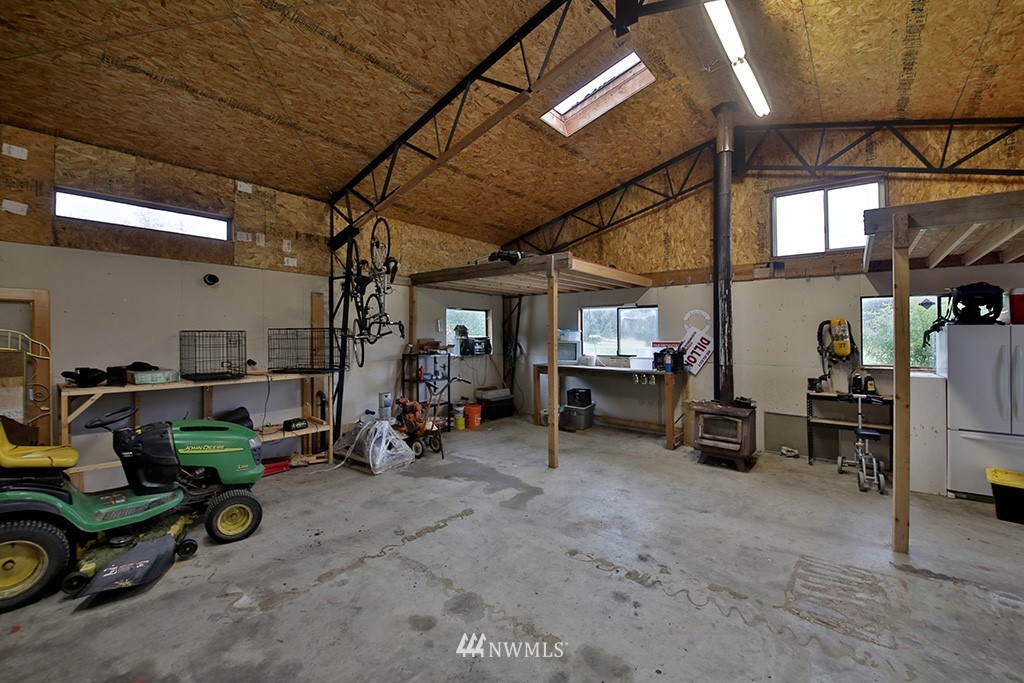 6301 Wahl Road Freeland, WA 98249 - Photo 33 of 40 a view of a garage with furniture