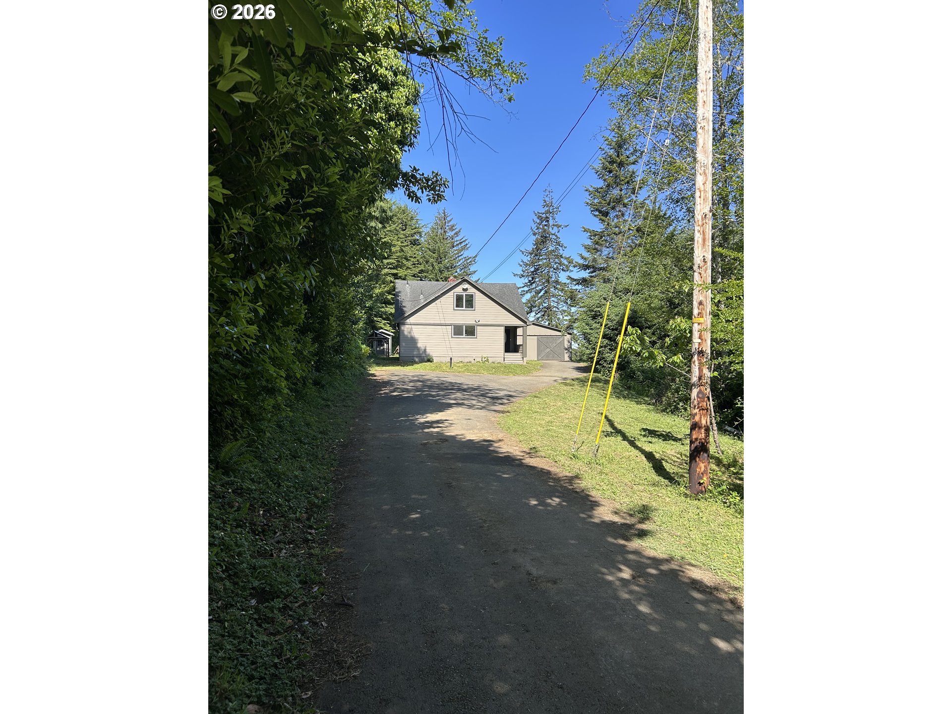 62356 Olive Barber Road Coos Bay, OR 97420 - Photo 5 of 34 a view of a house with a yard
