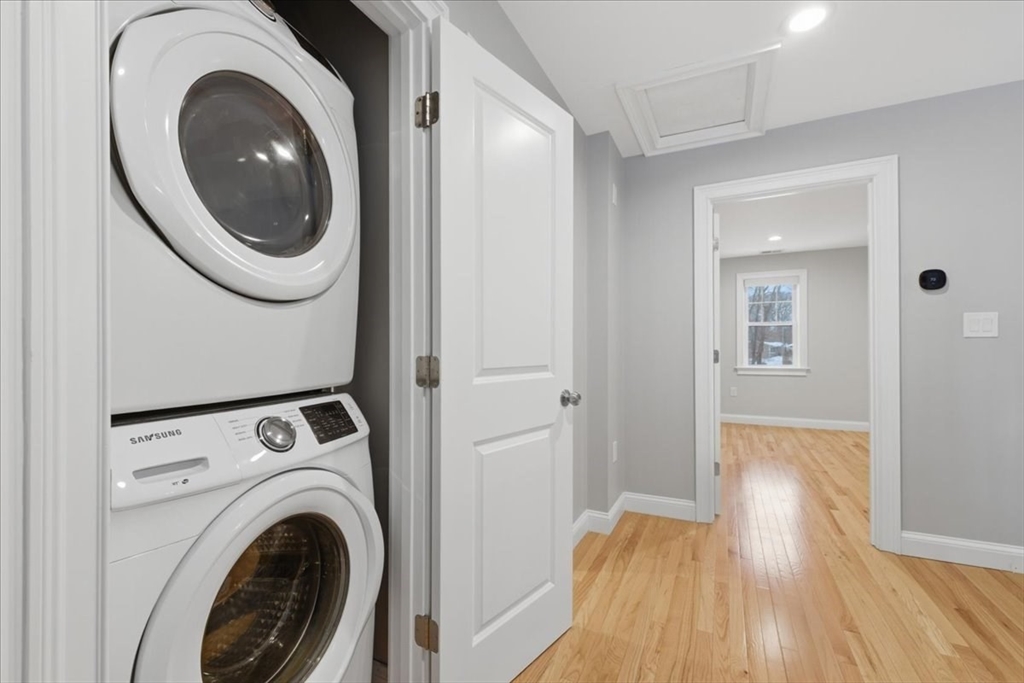 28 Eastover Road, Unit 28 Walpole, MA 02081 - Photo 16 of 34 a view of a hallway with washer and dryer