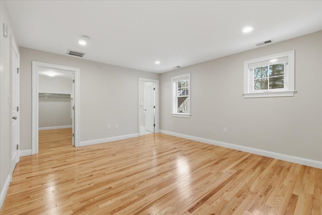 28 Eastover Road, Unit 28 Walpole, MA 02081 - Photo 18 of 34 a view of empty room with wooden floor