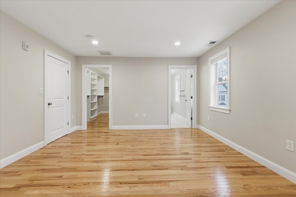 28 Eastover Road, Unit 28 Walpole, MA 02081 - Photo 19 of 34 a view of empty room with wooden floor