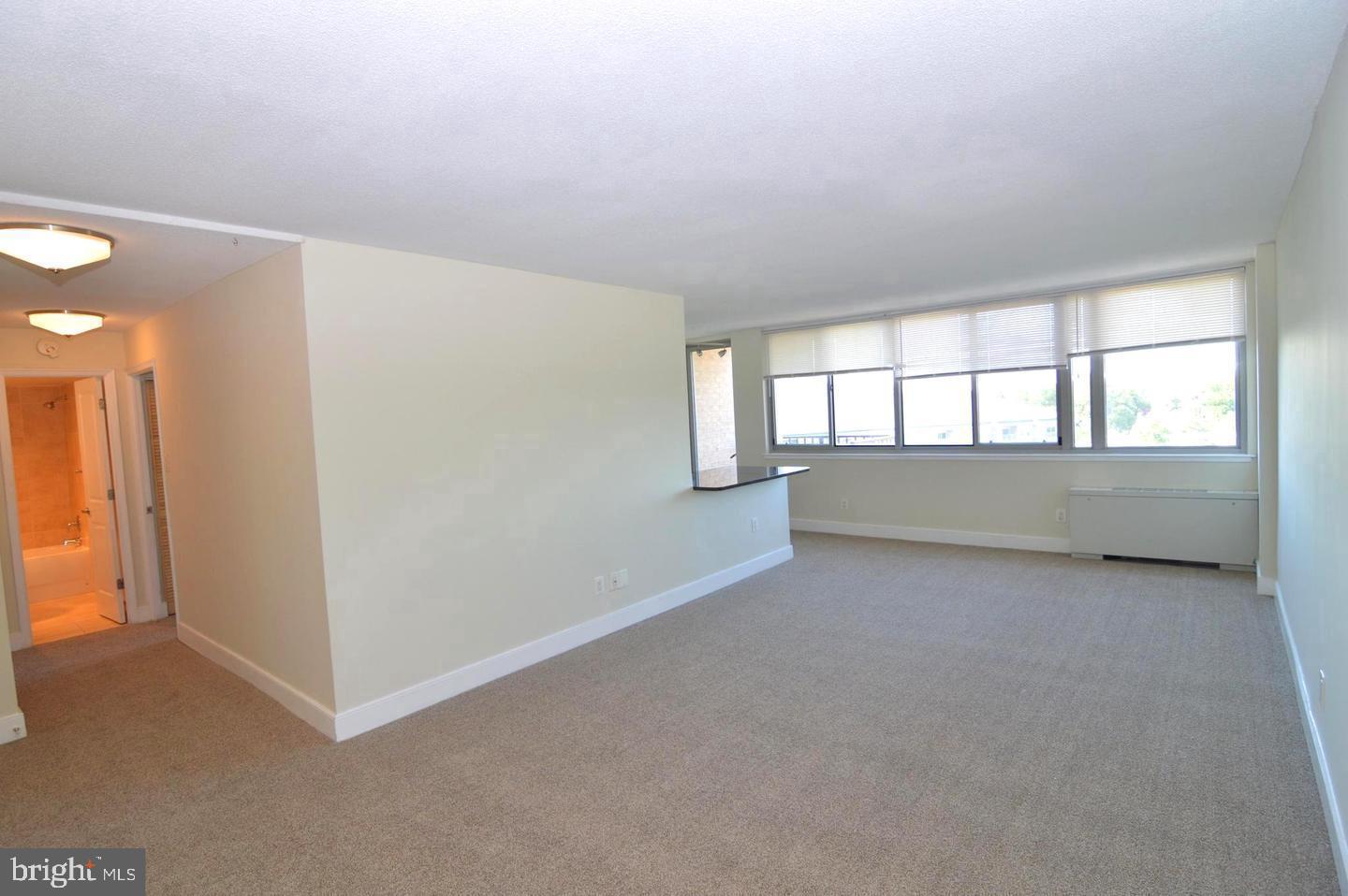 1220 Blair Mill Road, Unit 1007 Silver Spring, MD 20910 - Photo 5 of 27 a view of an empty room with a window
