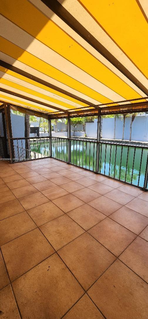 16504 Bridge End Road, Unit 16504 Miami Lakes, FL 33014 - Photo 4 of 22 Covered patio