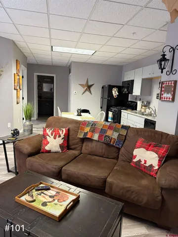 a living room with furniture and a table