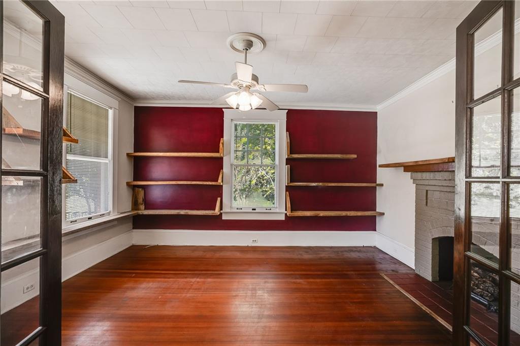 427 East College Street Bowdon, GA 30108 - Photo 11 of 30 a view of empty room with wooden floor and fan