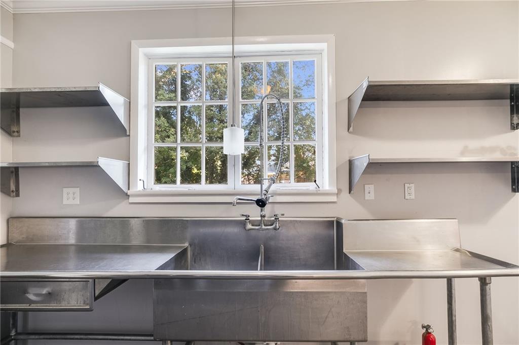 427 East College Street Bowdon, GA 30108 - Photo 14 of 30 a kitchen with a sink and a window