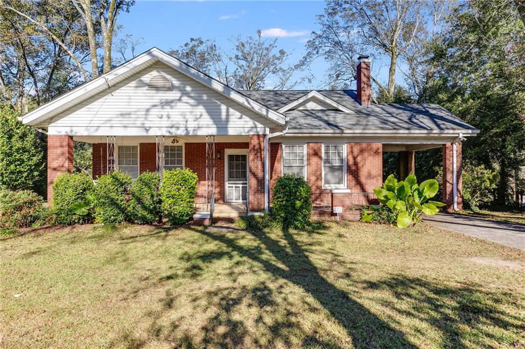 427 East College Street Bowdon, GA 30108 - Photo 2 of 30 a front view of house with yard and trees around