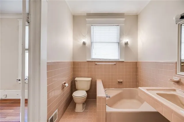 a bathroom with a sink a toilet and tub