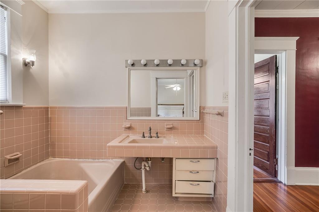 427 East College Street Bowdon, GA 30108 - Photo 22 of 30 a bathroom with a sink and a mirror