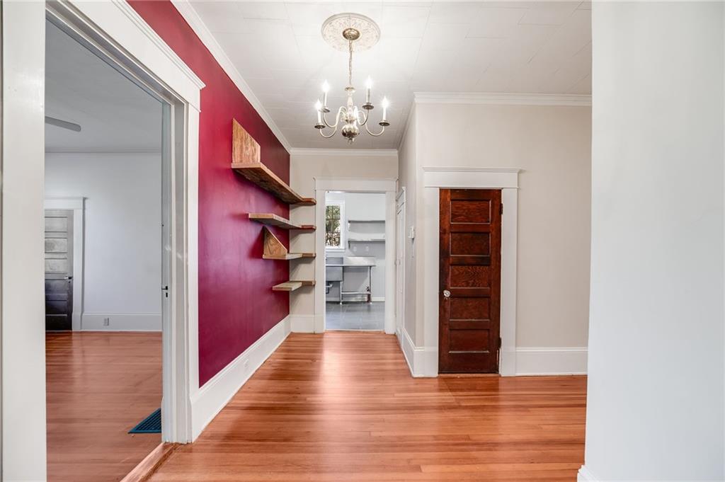 427 East College Street Bowdon, GA 30108 - Photo 23 of 30 a view of a hallway with wooden floor and staircase