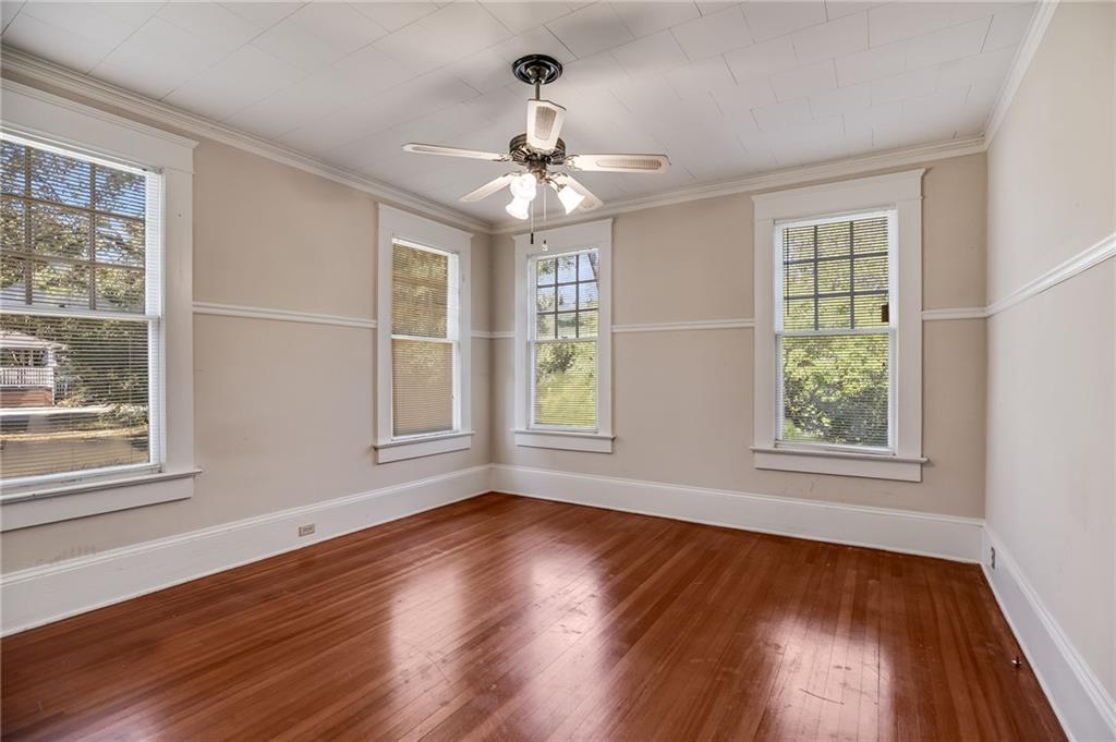 427 East College Street Bowdon, GA 30108 - Photo 24 of 30 a view of an empty room with wooden floor and a window