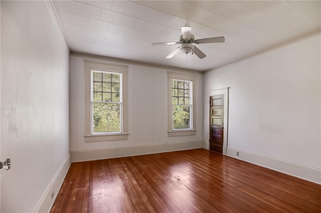 427 East College Street Bowdon, GA 30108 - Photo 25 of 30 a view of an empty room with wooden floor and a window