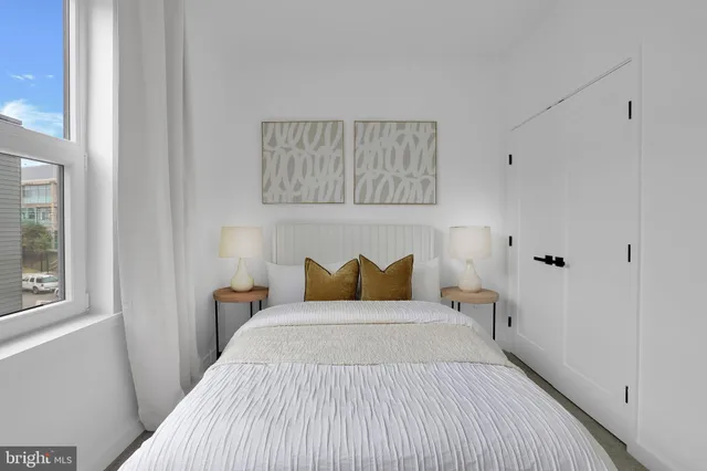 a bedroom with a bed and window