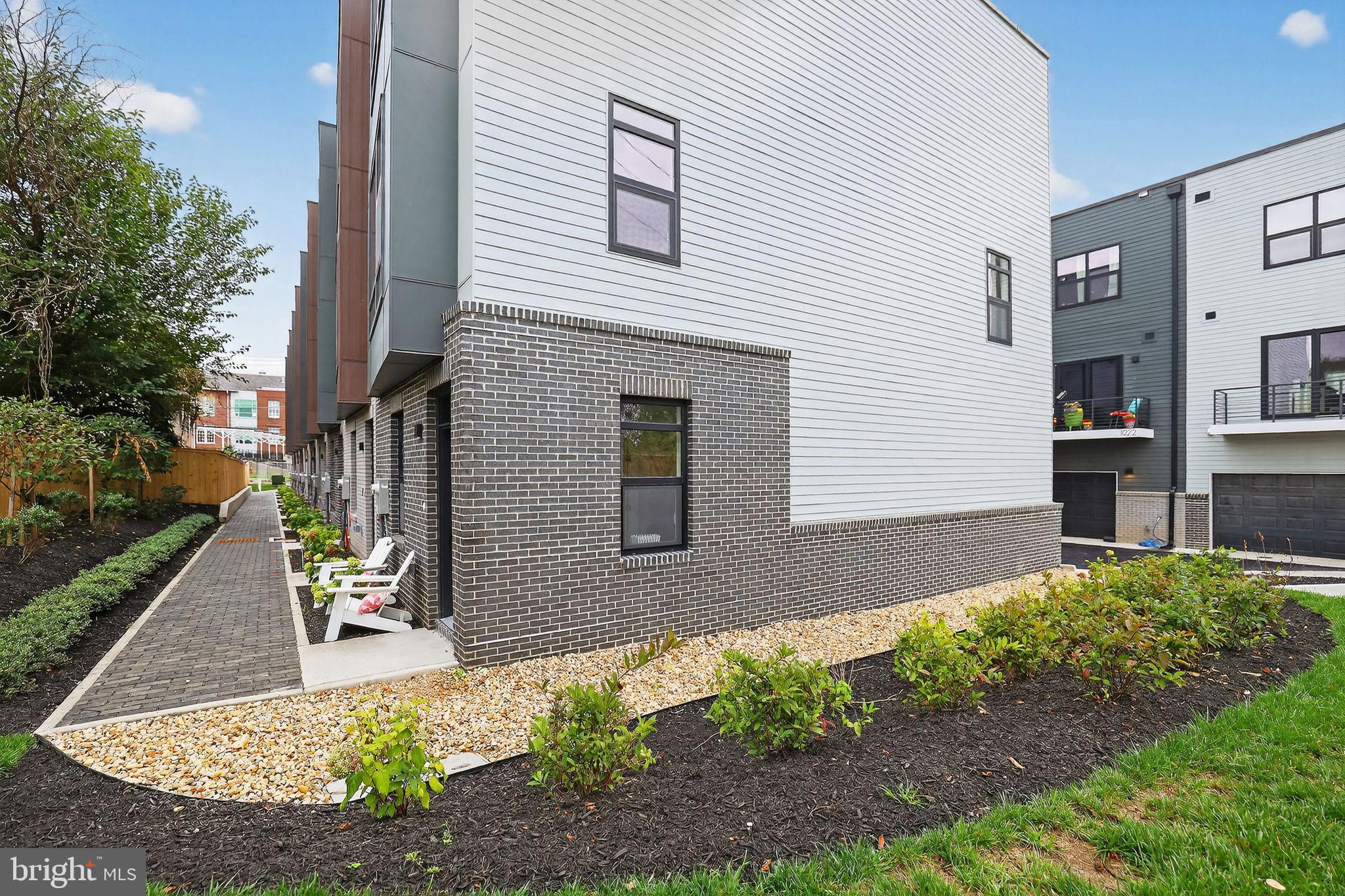 1028 Howard Road Southeast Washington, DC 20020 - Photo 23 of 35 a front view of a house with a yard