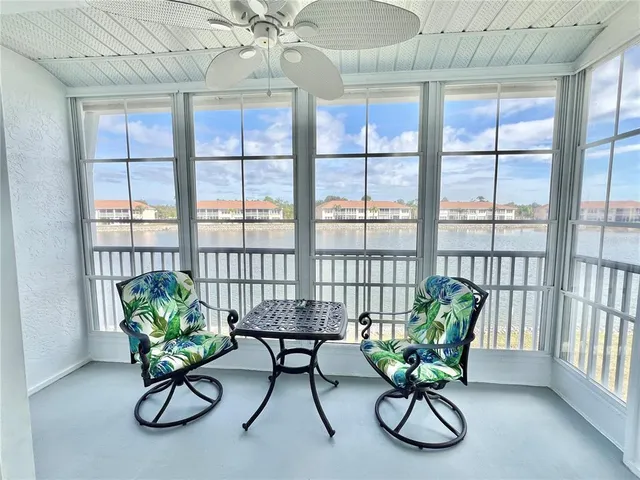 a view of a livingroom with furniture and a potted plant