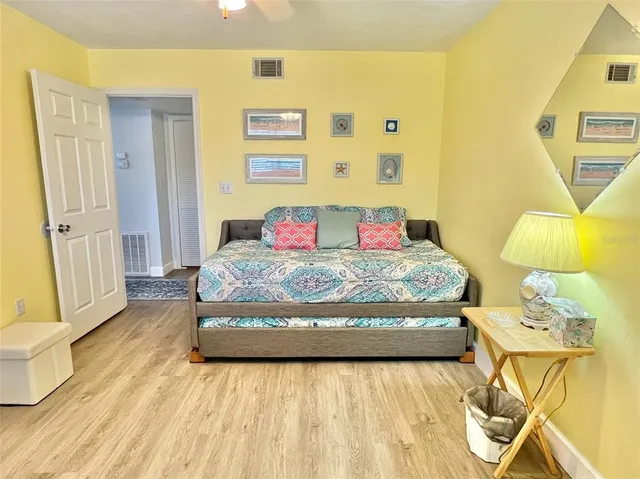 a bedroom with a bed and lamps