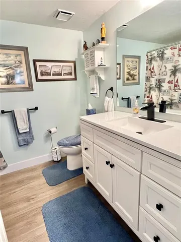 a spacious bathroom with a double vanity sink and a mirror
