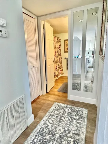 a view of entryway with bathroom and shower