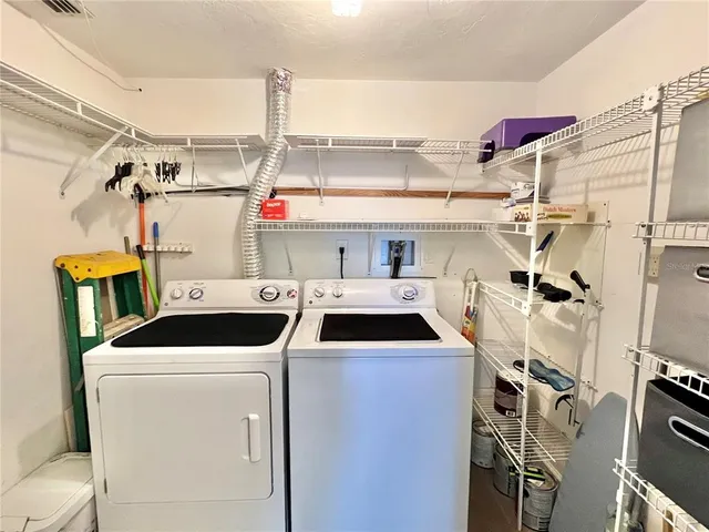 a utility room with dryer and washer