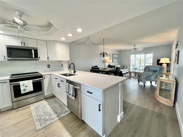 a kitchen with a stove and a microwave