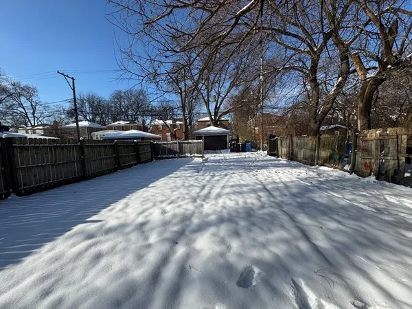 a view of a backyard of the house