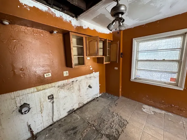 a spacious bathroom with a granite countertop sink a mirror and shower