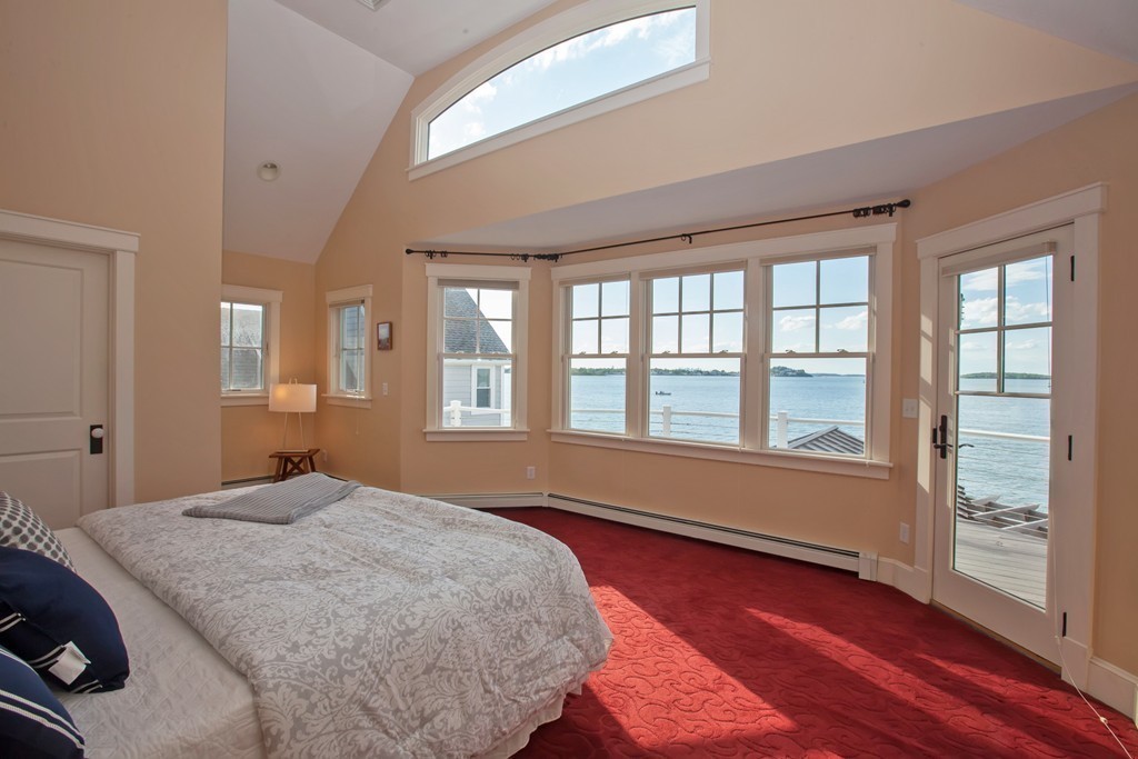 129 Fort Point Road Weymouth, MA 02191 - Photo 13 of 30 a bedroom with a bed and wooden floor