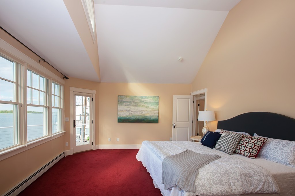 129 Fort Point Road Weymouth, MA 02191 - Photo 14 of 30 a bedroom with a large bed and a large window