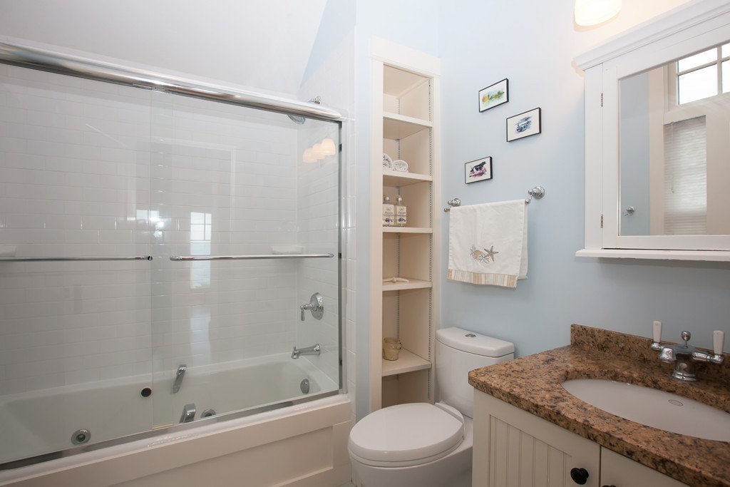 129 Fort Point Road Weymouth, MA 02191 - Photo 17 of 30 a bathroom with a granite countertop sink toilet and shower
