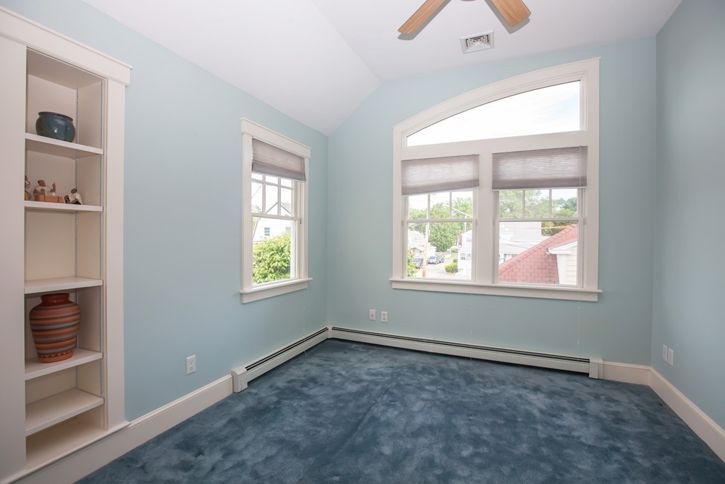 129 Fort Point Road Weymouth, MA 02191 - Photo 18 of 30 an empty room with a window and a chandelier fan