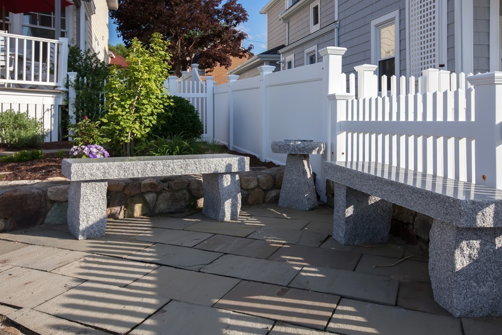 129 Fort Point Road Weymouth, MA 02191 - Photo 23 of 30 a view of a patio with a table and chairs and potted plants