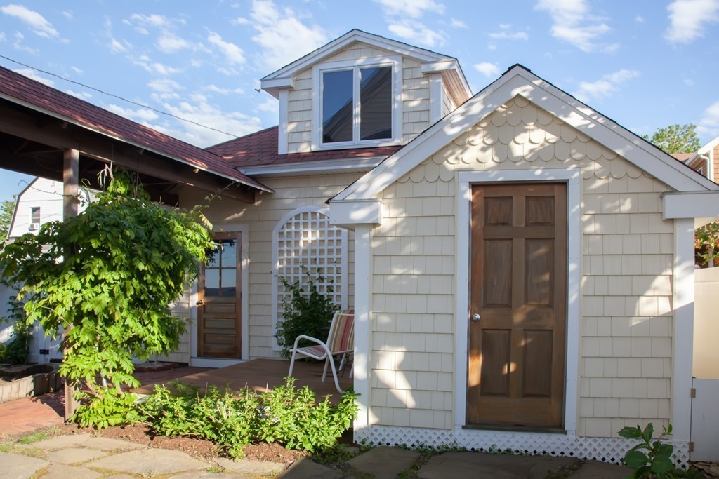 129 Fort Point Road Weymouth, MA 02191 - Photo 26 of 30 a front view of a house with a yard