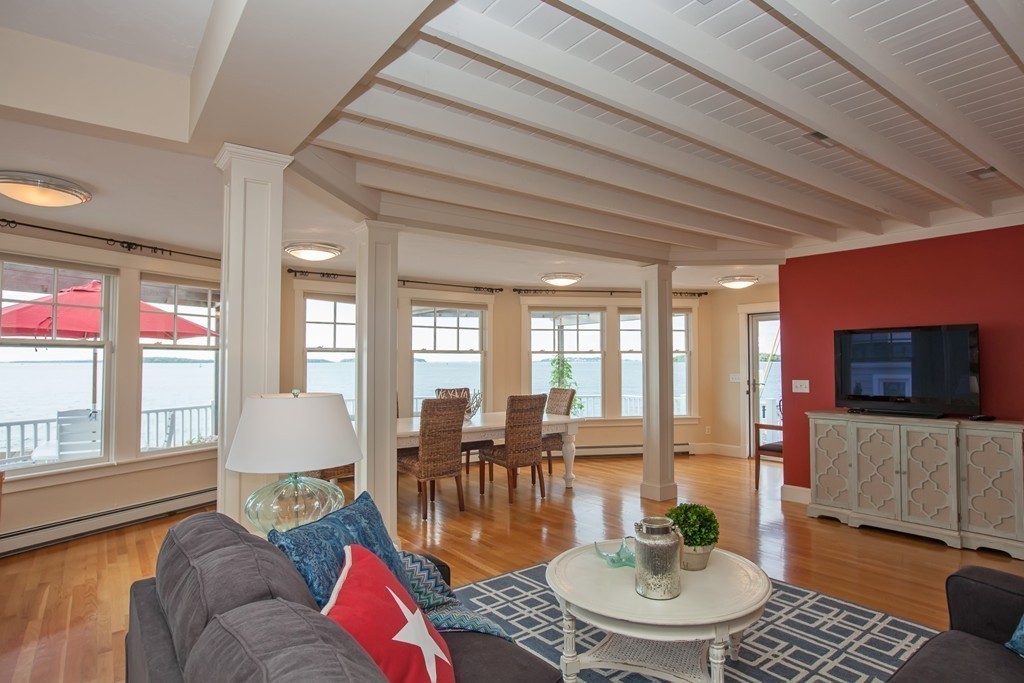129 Fort Point Road Weymouth, MA 02191 - Photo 5 of 30 a living room with furniture a flat screen tv and a large window
