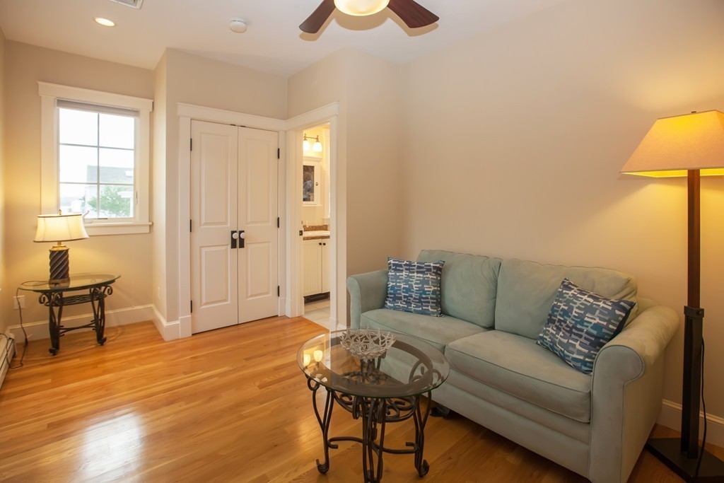 129 Fort Point Road Weymouth, MA 02191 - Photo 9 of 30 a living room with furniture and a lamp