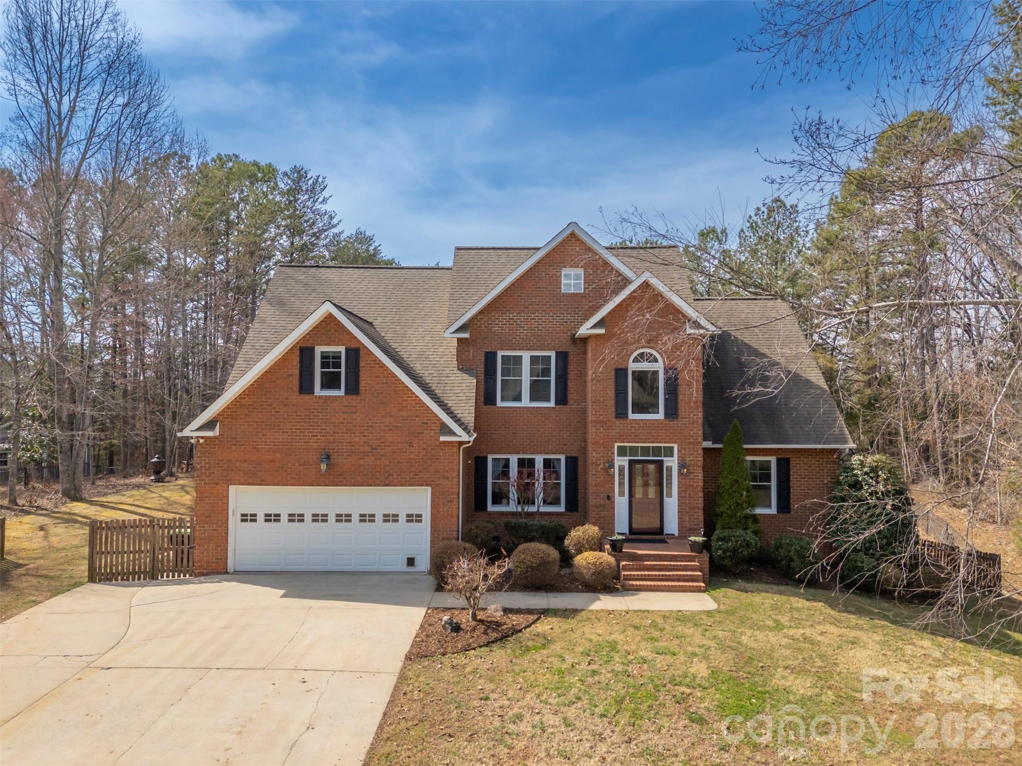 391 Chisholm Trail Rutherfordton, NC 28139 - Photo 1 of 39 a front view of a house with a yard outdoor seating and yard in the back