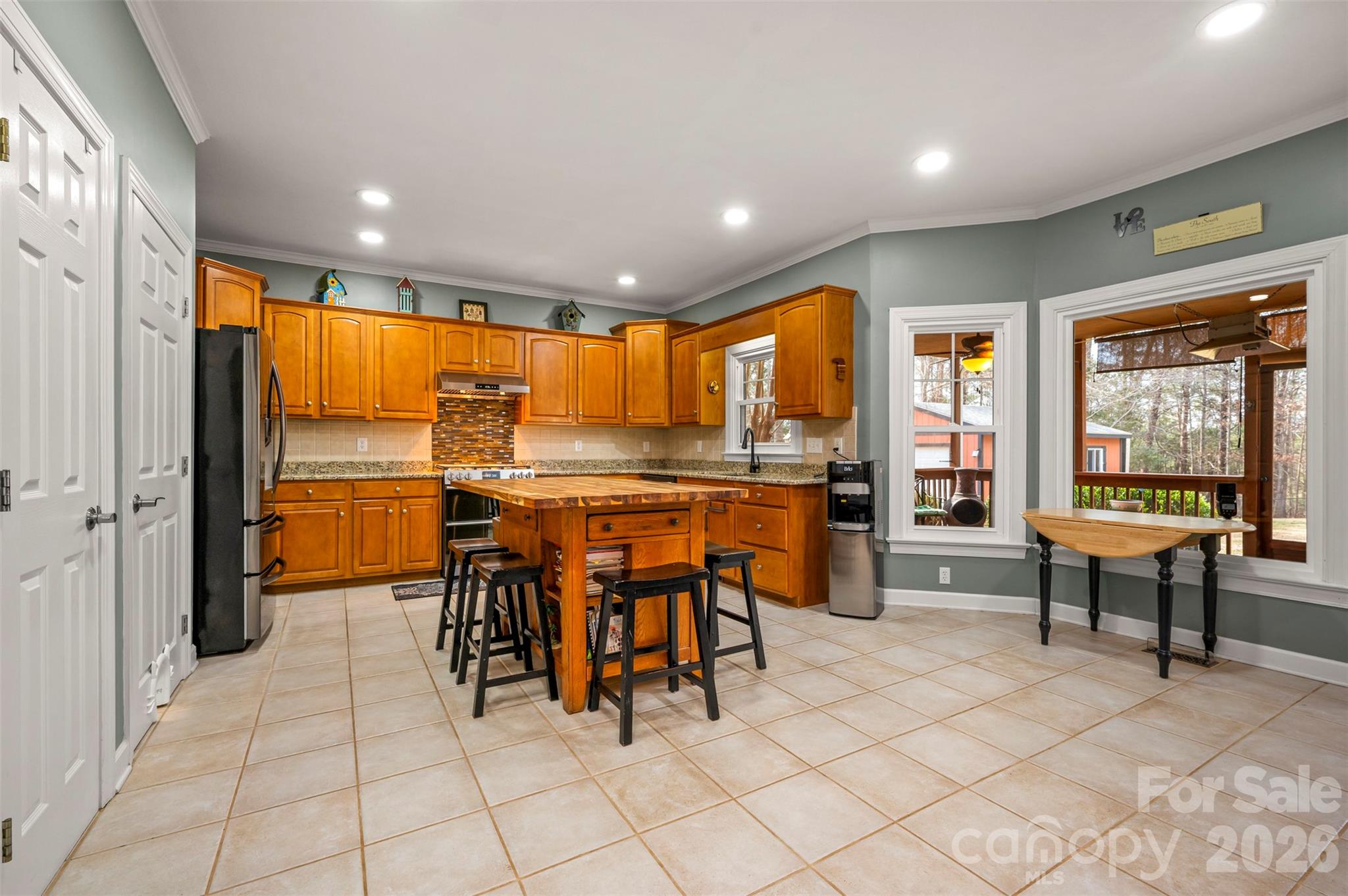 391 Chisholm Trail Rutherfordton, NC 28139 - Photo 11 of 39 a dining hall with stainless steel appliances a dining table chairs and view of living room
