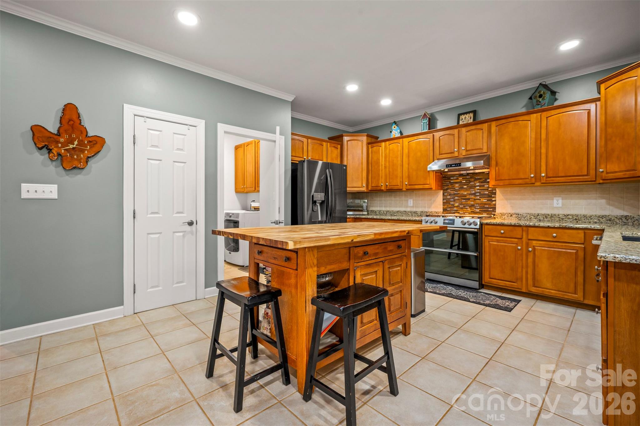 391 Chisholm Trail Rutherfordton, NC 28139 - Photo 12 of 39 a kitchen with stainless steel appliances granite countertop a stove top oven a sink a counter top space and cabinets