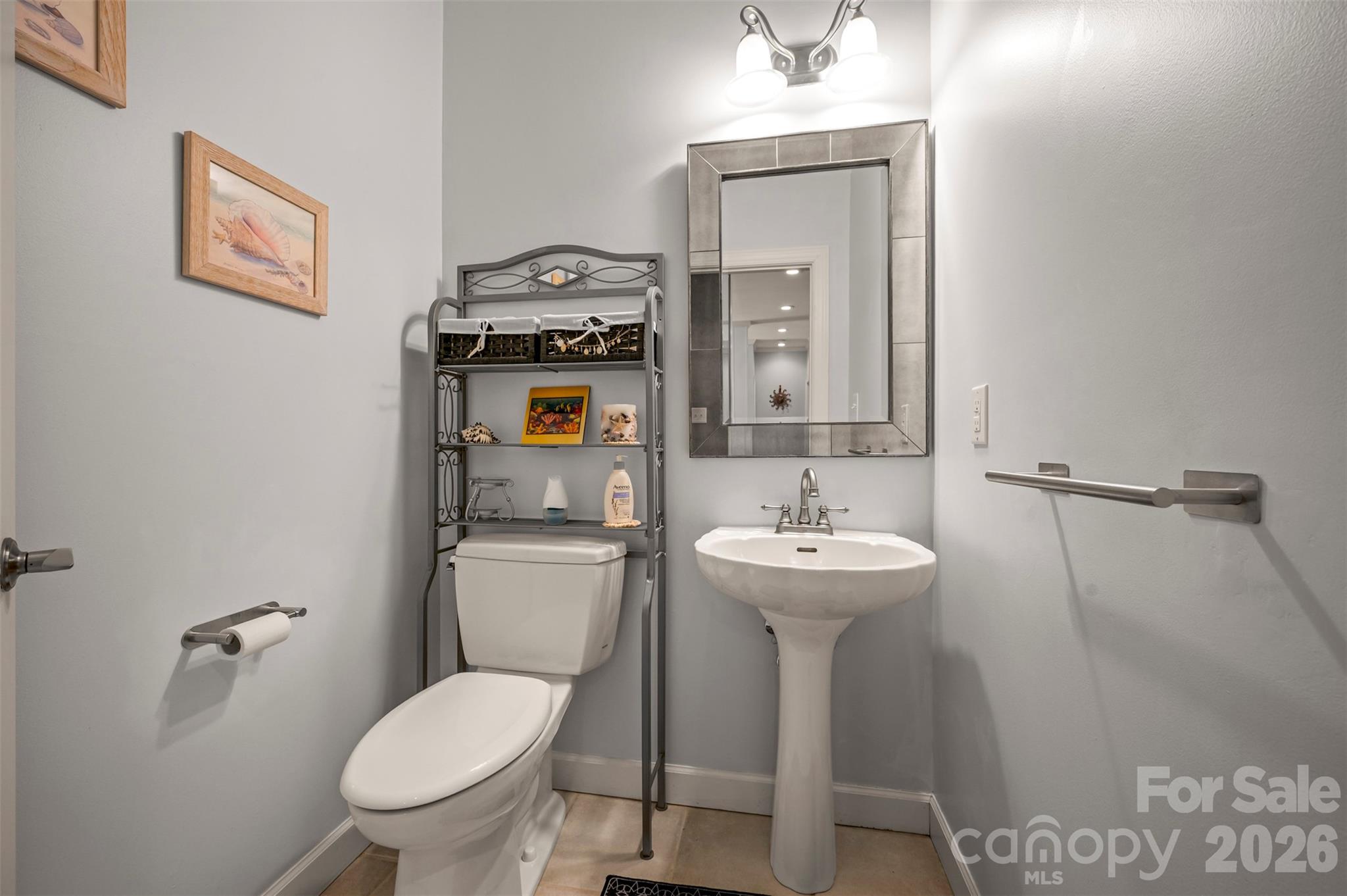 391 Chisholm Trail Rutherfordton, NC 28139 - Photo 16 of 39 a bathroom with a toilet sink and mirror