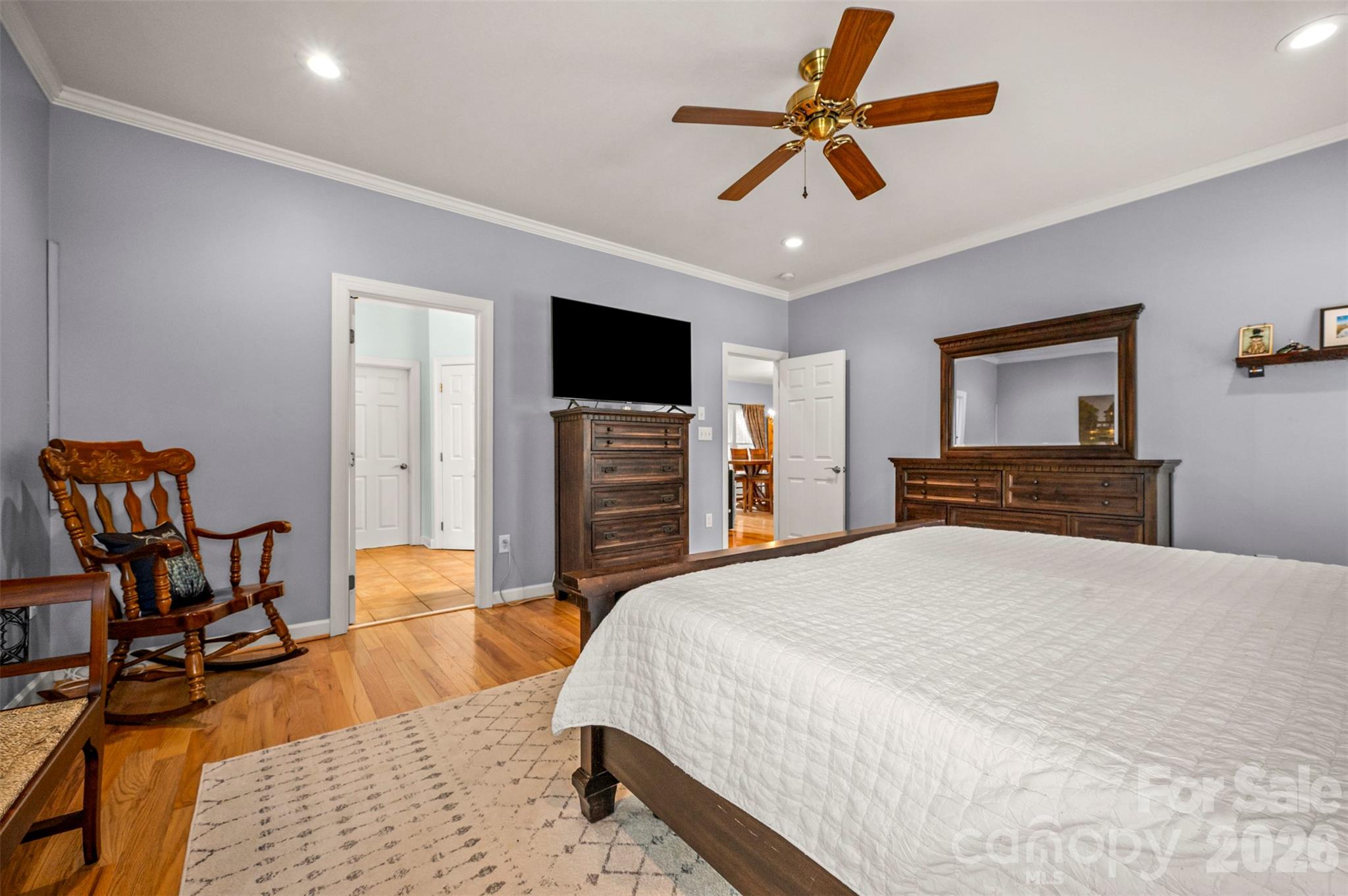 391 Chisholm Trail Rutherfordton, NC 28139 - Photo 18 of 39 a bedroom with a bed a chair and potted plant on the dresser