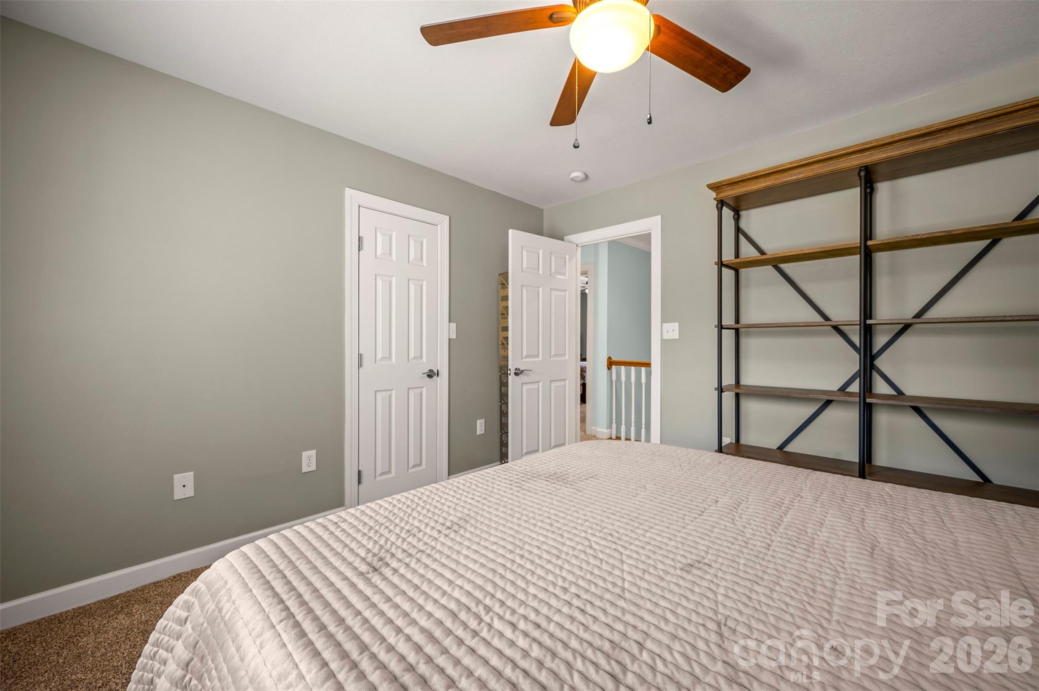 391 Chisholm Trail Rutherfordton, NC 28139 - Photo 23 of 39 a bedroom with a bed and a chandelier