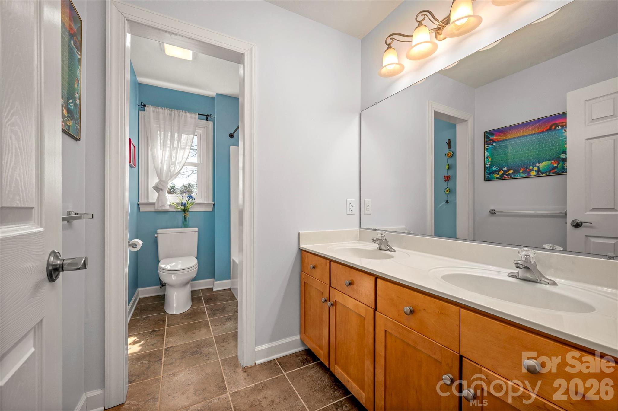 391 Chisholm Trail Rutherfordton, NC 28139 - Photo 26 of 39 a spacious bathroom with a granite countertop sink mirror and a toilet